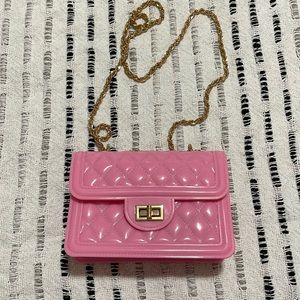 Pink rubber purse with golden chain
